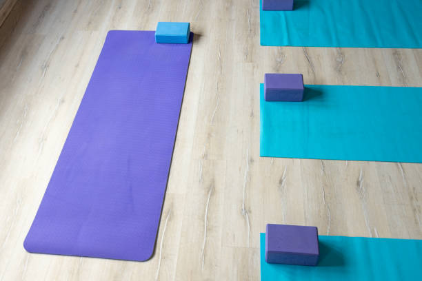 istock Yoga mats with blocks placed on floor in studio 1418969676