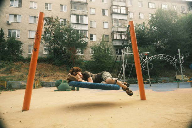 Woman is sleeping in hammock on playground