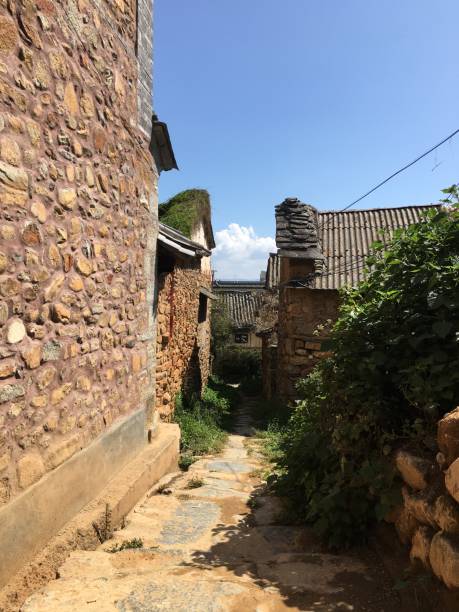 istock Village stone path dwellings quiet 1418982541