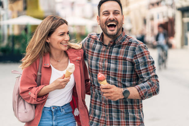 istock Happy couple eating ice cream 1418984306