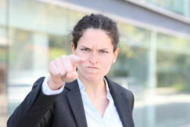 angry businesswoman accussing pointing you in the street - behavior women anger pointing imagens e fotografias de stock