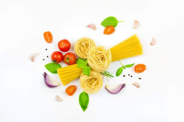 istock Ingredients for cooking pasta on a white background. Menu styling 1418988085
