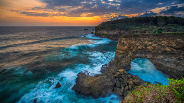 istock Sunset view at Batu Bolong Beach Pacitan East Java Indonesia 1418990884