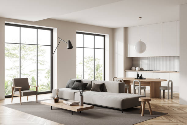 istock Studio interior with eating area and relax space, hidden shelves, panoramic window 1418995945