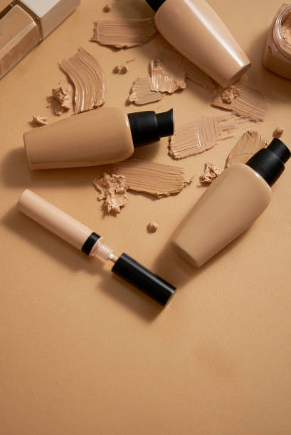 istock Bottles of makeup foundation and samples on beige background 1418996479