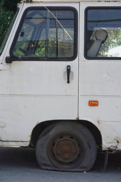 istock part of old rusty van and punctured tire 1418997906