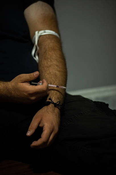 istock Young man using drugs and passed out after overdosed himself. 1418999223