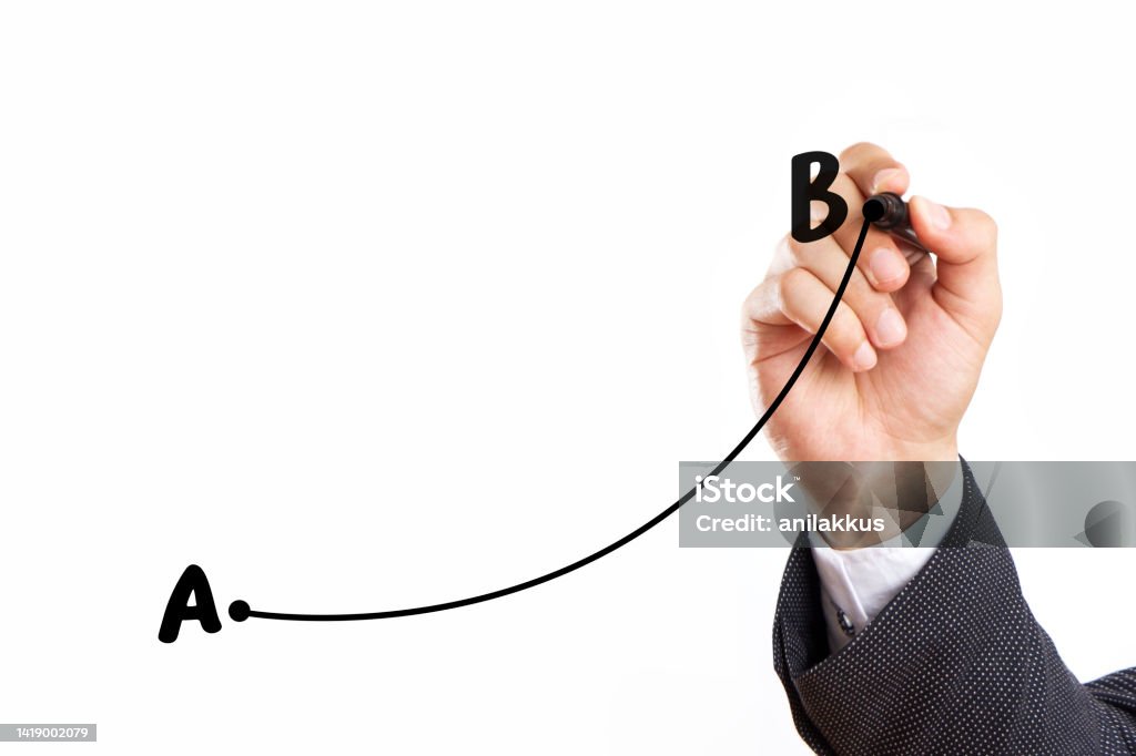 Businessman is Drawing Line from Point A to B Businessman is drawing line from point a to b on white background Letter B Stock Photo