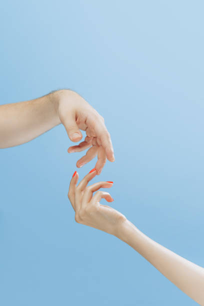 istock Touch. Graceful female hands gesturing isolated on blue background. Concept of relationship, feelings, community, care, support, symbolism, art 1419005041