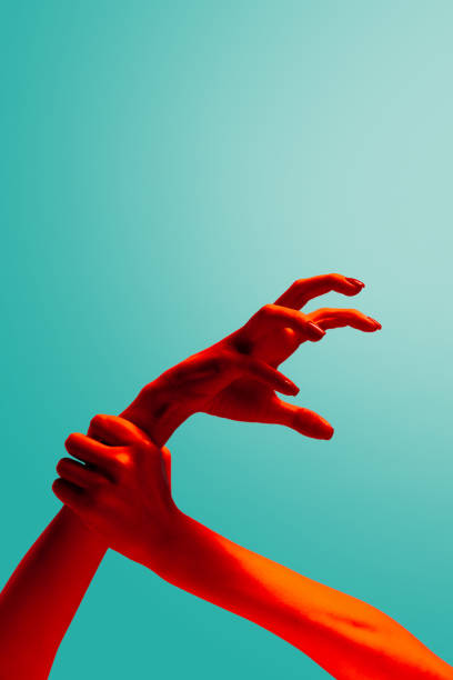 istock Stop agression. Female hands gesturing isolated on cyan color background in red neon light. Concept of relationship, community, care, support, symbolism, culture 1419005053