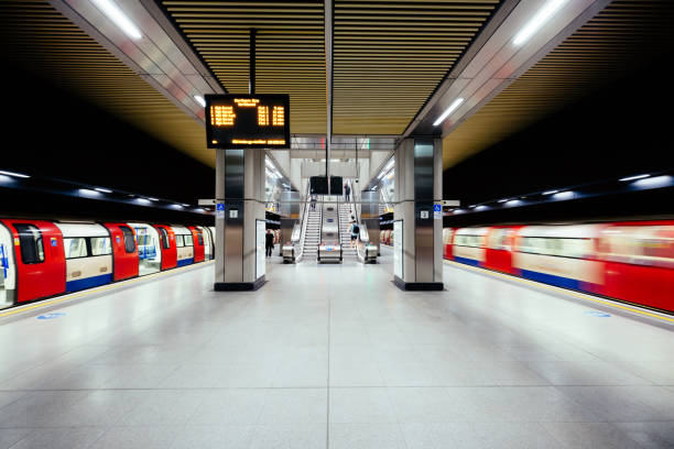 Blurred motion of tube train at modern Battersea Power Station underground station, London, UK stock photo