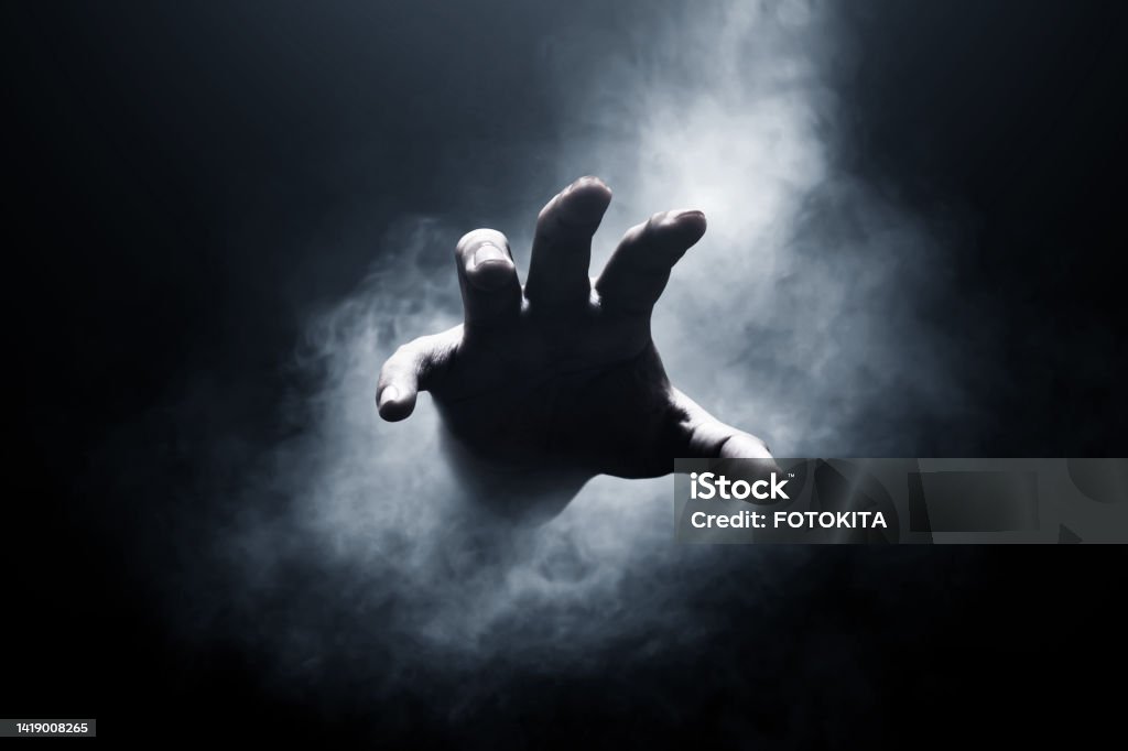 Human hand on dark background Hand Stock Photo