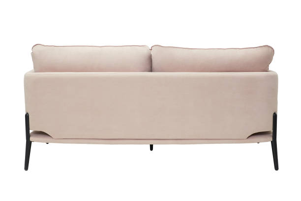 istock Modern pink fabric couch with black legs isolated on white background, back view 1419009936