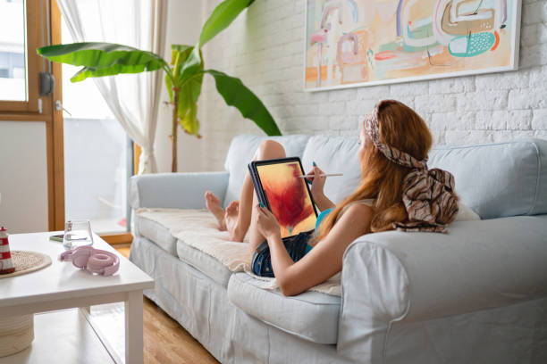 istock Creative Caucasian woman drawing on a digital tablet 1419011337