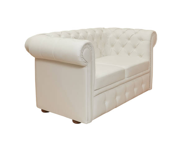 istock beige leather couch in vintage style isolated on white background, side view 1419011408