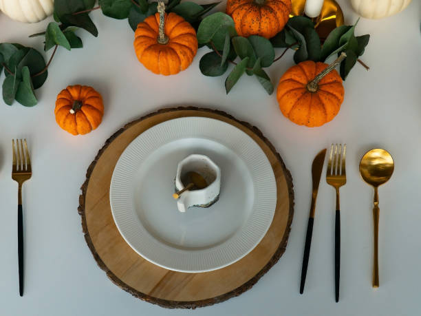 istock cutlery and crockery on a white table 1419012169