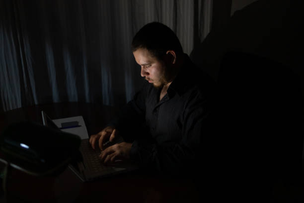 istock Young man at night working on his laptop finishing his work. 1419014253