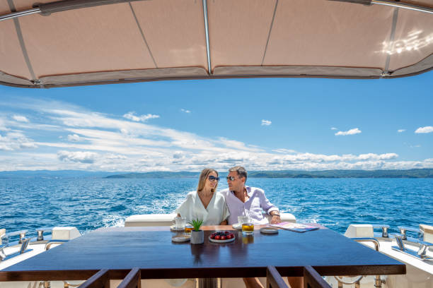 istock Couple relaxing on yacht 1419016068