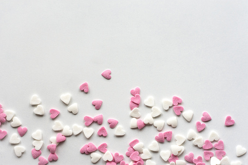 pink and white mini heart shapes for decorating baked goods like cakes and cupcakes