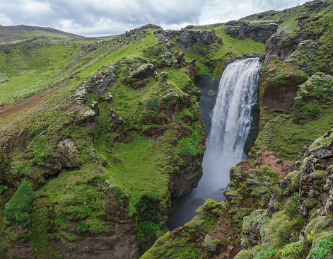 Beautifull waterfall on the Skoga River with rainbow and no people on famous Fimmvorduhals trail second part of Laugavegur trek. Summer landscape on a sunny day. Amazing in nature. August 2019, South Iceland.