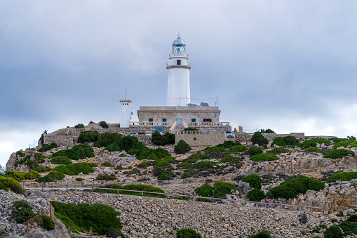 Alcudia, Spain - Aug 23, 2022: Lighthouse of Cap de Formentor in the northeast of the balearic island of Majorca (Mallorca).