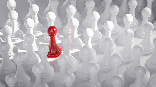 istock Standout Concept Red Pawn Chess Between White Pawns 3D Render 1419023659