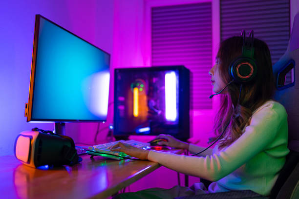 istock Asian gamer playing online video game winning excited on PC with lighting effect, broadcast streaming live at home. Gamer and E-Sport online gaming technology Championship tournament gamer concept. 1419023993