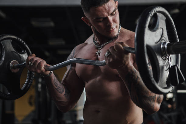 istock Muscular male bodybuilder working out at gym 1419025658