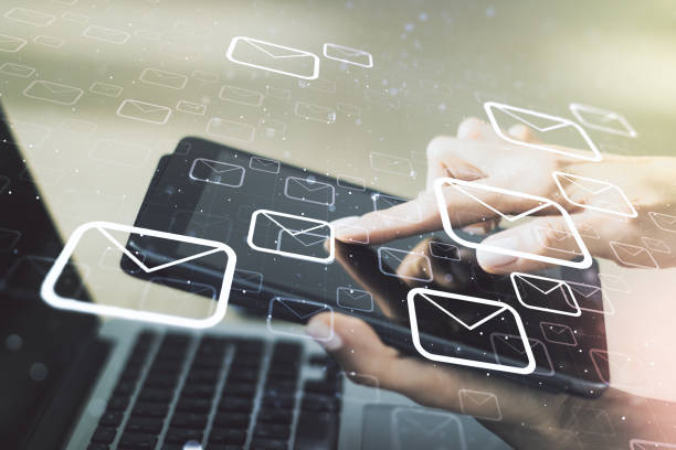 istock Creative abstract postal envelopes sketch and hand working with a digital tablet on background, e-mail and marketing concept. Double exposure 1419026110