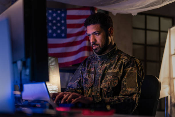 istock American hacker in military unifrorm on dark web, cyberwar concept. 1419026172