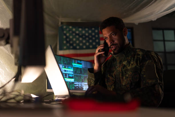 istock American hacker in military unifrorm on dark web, cyberwar concept. 1419026259