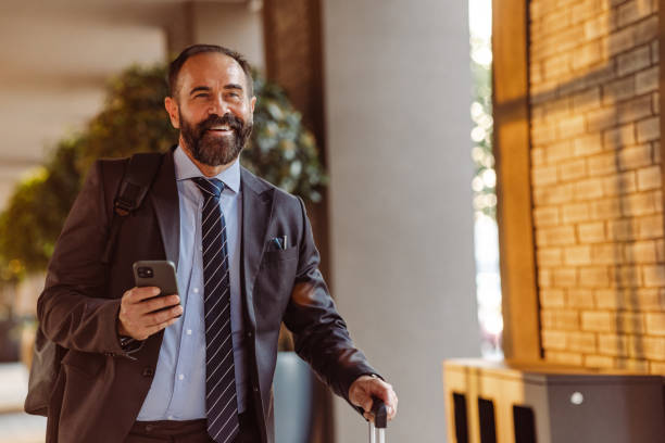istock Confident mature businessman with smart phone 1419026832