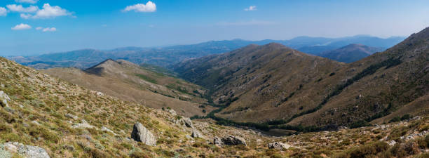 istock Panoramic view from Punta La Marmora highest mountain peak at Gennargentu mountain in Sardinia, Nuoro, Italy. Vaste peaks, dry plains and valleys with mediterranean vegetation. Late summer, blue sky 1419027834