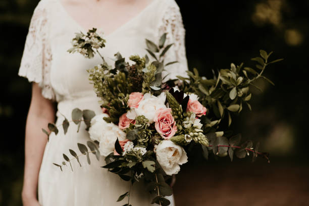 istock A bride is holding a beautiful bouquet in her hand. 1419028127
