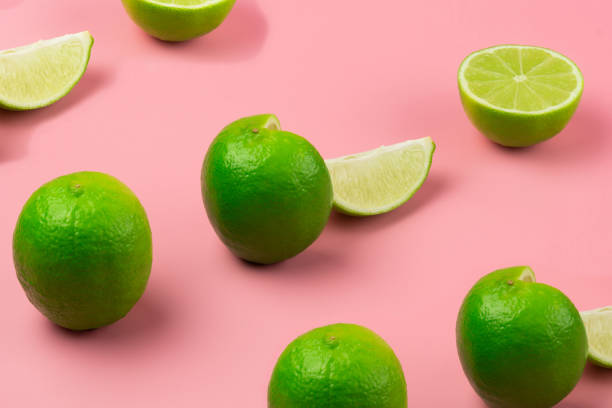 istock a whole lime and sliced limes are arranged in a row on a pink background 1419032916