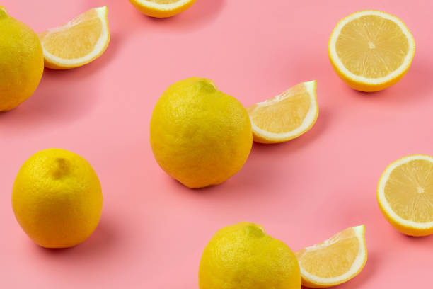 istock a whole lemon and sliced lemons are arranged in a row on a pink background 1419033034
