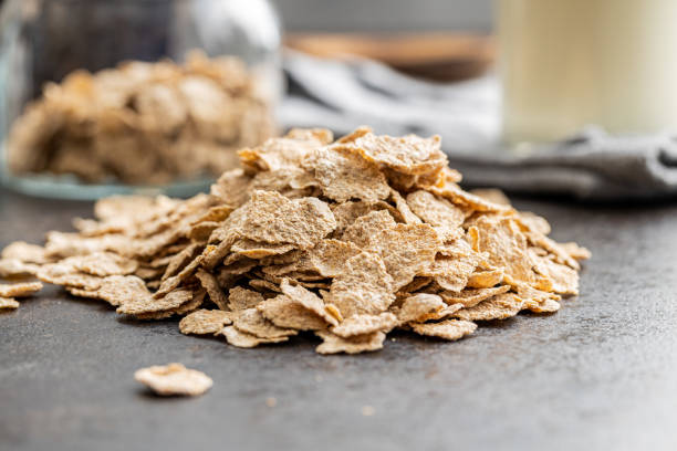 istock Whole grain cereal flakes. Wholegrain breakfast cereals kitchen table. 1419034029