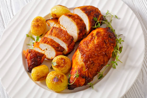 istock grilled chicken breasts with browned new potatoes 1419036629