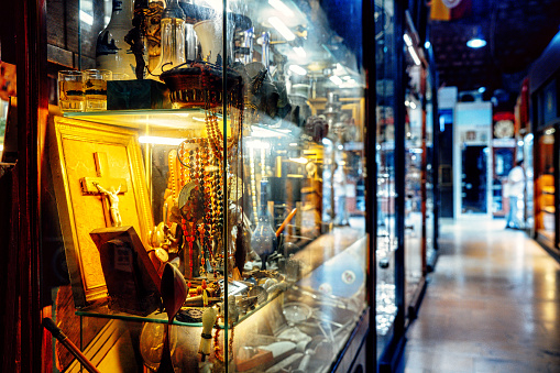 Lviv, Ukraine - December 28, 2019: Lvov winter Christmas local souvenirs gifts in closed shop store entrance exterior called Kvartira 15 on storefront display window