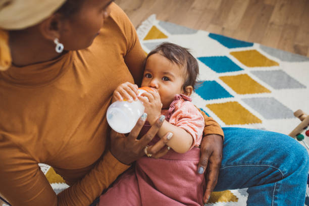 Young mother with baby at home