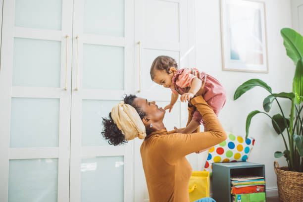istock Young mother with baby at home 1419042475