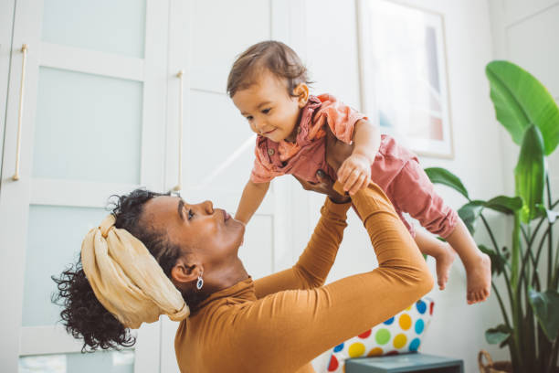 istock Young mother with baby at home 1419042486