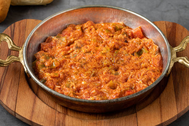 Traditional turkish breakfast food menemen made by eggs and tomatoes stock photo