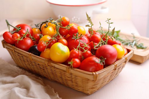Variatin of tomatoes in a basket