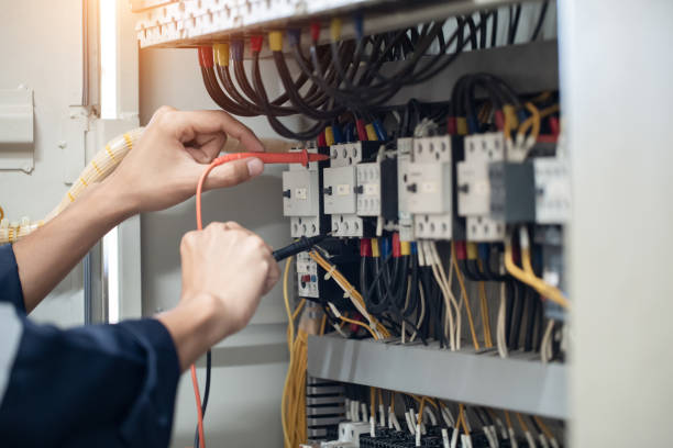 istock Electrician engineer work tester measuring voltage and current of power electric line in electical cabinet control , concept check the operation of the electrical system . 1419046568