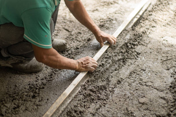 istock Close up Asian  worker laying down  smooth cement on work site 1419052235