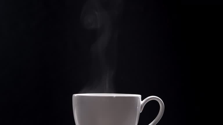 Hot coffee cup on black background,Close-up