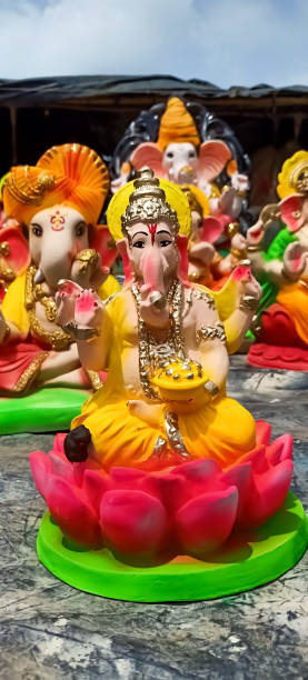 istock Beautiful laughing Lord genesha prepared by clay mud completely hand work 1419057169
