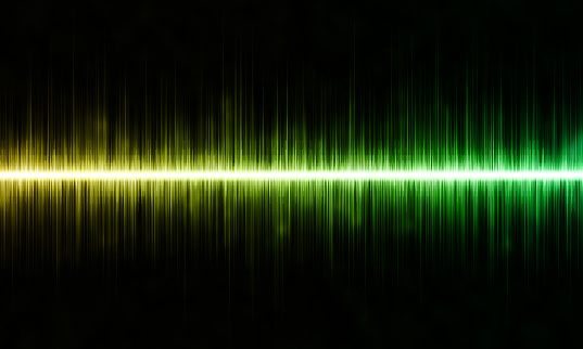 Yellow and green abstract sound, audio or music wave on black background.