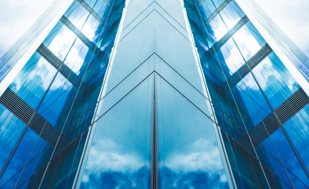 istock underside panoramic and perspective view to steel blue glass high rise building skyscrapers 1419060863